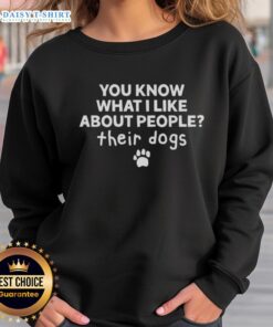 Alt Text: Happy person wearing 'I Like About People Their Dogs' sweatshirt, showcasing love for dogs and cozy style.