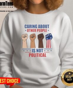 Alt Text: Hot Caring About Other People Is Not Political Fists Sweatshirt featuring a bold graphic design on a cozy sweatshirt.