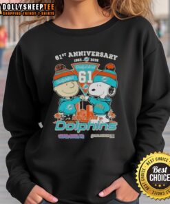 Alt Text: Hot Charlie Brown and Snoopy 61st Anniversary sweatshirt features Miami Dolphins football skyline design, 1965-2026.