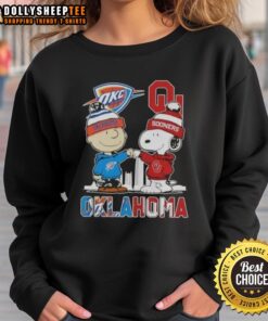 Alt Text: Hot Charlie Brown and Snoopy Oklahoma City Sports Thunder x Sooners skyline sweatshirt, perfect for fans.