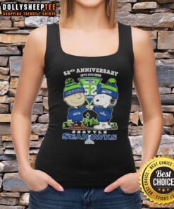 Alt Text: Hot Charlie Brown and Snoopy tank top celebrating Super Bowl 52nd Anniversary 1974-2026 with Seahawks skyline design.