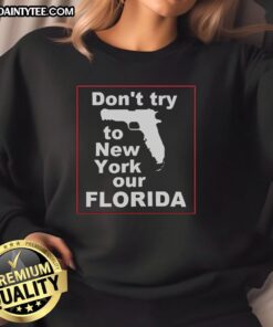 Cozy 'Hot Don't Try to New York Our Florida' sweatshirt displayed on a vibrant background, perfect for Florida lovers.