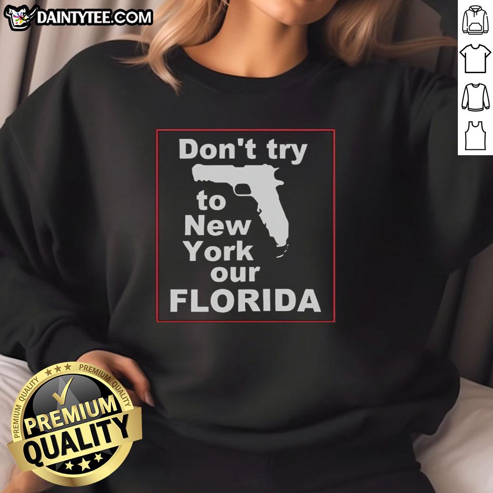 hot-dont-try-to-new-york-our-florida-sweatshirt Cozy 'Hot Don't Try to New York Our Florida' sweatshirt displayed on a vibrant background, perfect for Florida lovers.