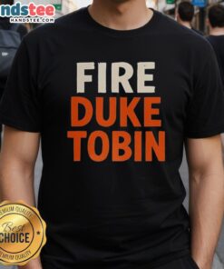 Hot Fire Duke Tobin T-Shirt featuring a bold graphic design celebrating Duke Tobin's legacy in sports fashion.