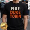 Hot Fire Duke Tobin T-Shirt featuring a bold graphic design celebrating Duke Tobin's legacy in sports fashion.