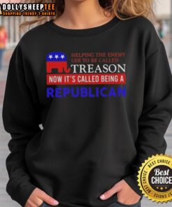 Alt Text: Hot Helping The Enemy sweatshirt design, highlighting treason and Republican themes in a bold, stylish graphic.