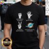 Hot Miami Dolphins t-shirt featuring 'Nothing Beats Rock Beats Scissors Paper Beats Rock Scissors Beats Paper' design.
