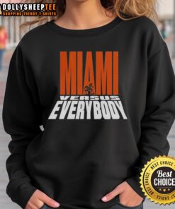 Alt Text: Hot Miami Hurricanes Football sweatshirt featuring 'Miami Versus Everybody' mascot silhouette design.