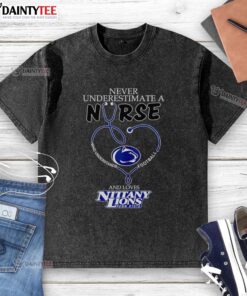 Alt Text: Hot 'Never Underestimate a Nurse' football-themed Penn State Nittany Lions heart washed t-shirt on display.