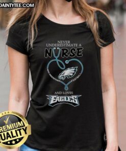 Hot ladies tee featuring 'Never Underestimate a Nurse Who Loves Football' design, perfect for Philadelphia Eagles fans.