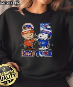 Hot New York Mets and New York Rangers Snoopy sweatshirt featuring vibrant team colors and iconic Snoopy design.