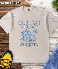 Hot Sleigh All Day with BidFTA washed t-shirt displayed on a rustic wooden background, perfect for holiday wear.