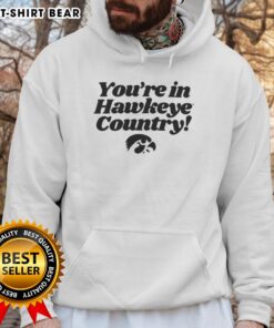 Cozy 'Hot You're in Hawkeye Country' hoodie displayed on a mannequin against a rustic backdrop, perfect for fans.