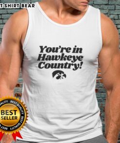 Hot You're in Hawkeye Country tank top displayed on a wooden background, perfect for Iowa fans and summer wear.