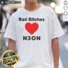 Stylish 'Nice Bad Bitches Love Neon' T-Shirt in vibrant colors, perfect for trendy fashion lovers and neon enthusiasts.