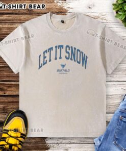 Nice Buffalo Bulls Victor Snow Let It Snow washed t-shirt displayed on a hanger, perfect for fans and winter style.
