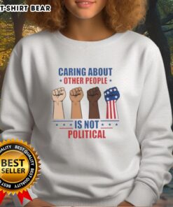 Nice Caring About Other People Is Not Political Fists Sweatshirt in a cozy, casual style showcasing a bold message.