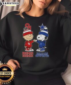 Charlie Brown and Snoopy fist bump on a Dallas Cowboys sweatshirt, perfect for fans of Nice Charlie Brown apparel.