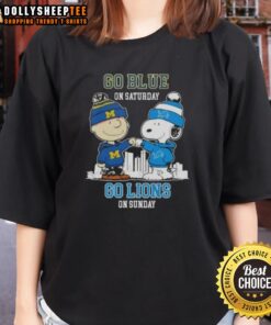 Charlie Brown and Snoopy fist bump in Detroit Lions gear on skyline ladies tee, celebrating game day excitement.