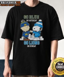 Charlie Brown and Snoopy fist bump on a skyline tee, promoting Detroit Lions spirit for game days. Go Blue on Saturday!