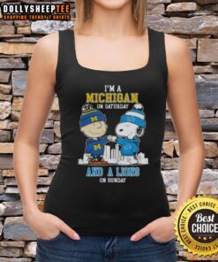 Alt Text: Charlie Brown fist bump with Snoopy on a tank top featuring Michigan and Detroit Lions skyline design.