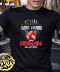 Nice Cross God First Family Second Then Nebraska Volleyball T-Shirt design featuring bold text and a vibrant color scheme.