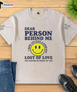 Person wearing a 'Lost of Love' washed T-shirt, showcasing a stylish and sentimental fashion choice.