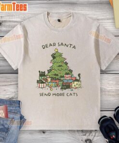 Cute washed T-shirt featuring 'Dear Santa, Send More Cats' design with a Christmas tree, perfect for cat lovers.