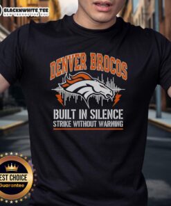 Alt Text: Nice Denver Broncos Built In Silence Strike Without Warning T-Shirt featuring bold team graphics and vibrant colors.