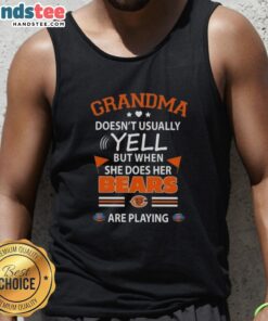 Nice grandma wearing a Chicago Bears tank top, excitedly cheering during a football game.