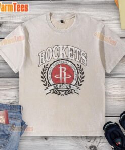 Alt Text: Retro washed t-shirt featuring the Houston Rockets NBA logo framed by a laurel wreath, showcasing vintage style.