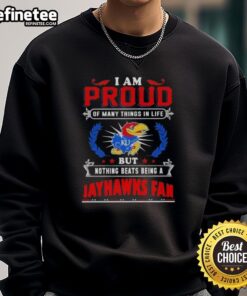 Cozy sweatshirt with 'Proud Kansas Jayhawks Fan' graphic, perfect for showing team spirit and support for KU basketball.