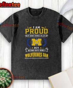 Michigan Wolverines fan proudly wearing a washed t-shirt, showcasing team spirit and love for college football.