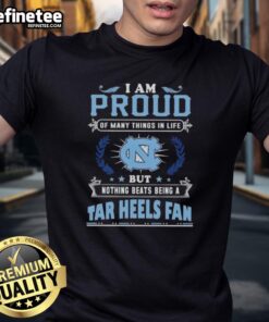Alt Text: North Carolina Tar Heels fan t-shirt with 'I Am Proud Of Many Things But Nothing Beats Being A Fan' slogan.