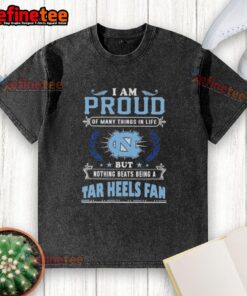 North Carolina Tar Heels fan proudly wearing a washed t-shirt showcasing their love for the team and school spirit.