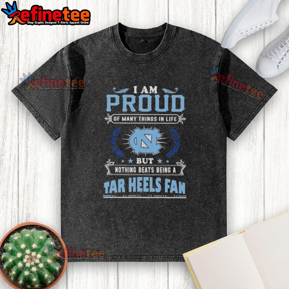 nice-i-am-proud-of-many-things-in-life-but-nothing-beats-being-a-north-carolina-tar-heels-fan-washed-t-shirt North Carolina Tar Heels fan proudly wearing a washed t-shirt showcasing their love for the team and school spirit.