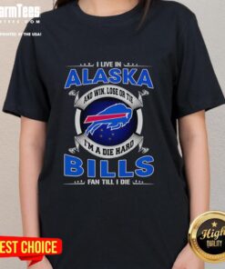 Alaska fan wearing a 'Dead Hard Buffalo Bills Fan' tee, showcasing team spirit and pride in a scenic outdoor setting.