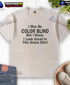 Man wearing a green washed t-shirt, confidently stating, 'I may be color blind but I know I look green.'