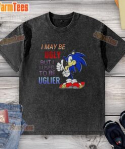 Cartoon hedgehog on a washed t-shirt with the phrase 'I may be ugly but I used to be uglier' highlighting quirky humor.