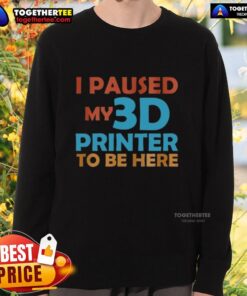 Nice I Paused My 3D Printer To Be Here Sweatshirt in a cozy setting, showcasing a fun design for 3D printing enthusiasts.