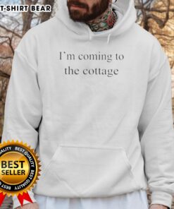 Cozy 'Nice, I'm Coming to the Cottage' hoodie displayed on a rustic background, perfect for cottage getaways and casual style.