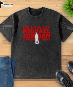 Man wearing a washed t-shirt with 'I'm like the Michael Jordan of standing in this spot' graphic, posing confidently.