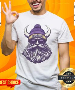 Alt Text: Minnesota Vikings mascot in a beanie and sunglasses t-shirt, showcasing team spirit and style in vibrant colors.