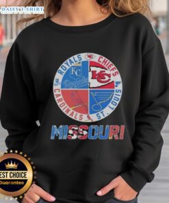 Cozy sweatshirt featuring Kansas City Chiefs, Royals, St. Louis Cardinals, and Blues logos, perfect for sports fans.