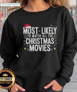Cozy sweatshirt featuring 'Most Likely To Watch All The Christmas Movies' design, perfect for holiday movie lovers.