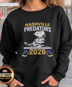 Alt Text: 2026 Nice Nashville Predators Hockey Snoopy Peanuts sweatshirt featuring colorful design and team logo.