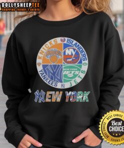 Alt Text: Cozy sweatshirt featuring a mashup logo of the New York Knicks, Islanders, Yankees, and Jets for sports fans.