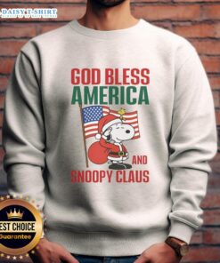 Alt Text: Nice Peanuts God Bless America and Snoopy Claus sweatshirt featuring festive design and vibrant colors for holiday cheer.