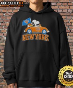 Alt Text: Snoopy driving a car in a New York Knicks basketball hoodie with colorful peanuts design, perfect for fans.