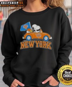 Nice Peanuts Snoopy driving a car on a New York Knicks basketball sweatshirt, perfect for fans and collectors.